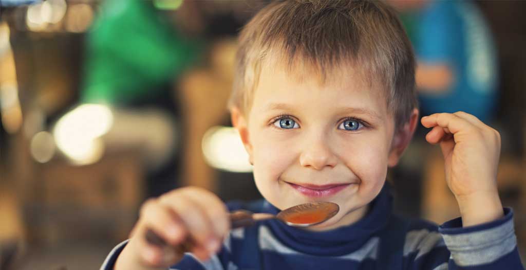 young-boy-eating-soup-crop